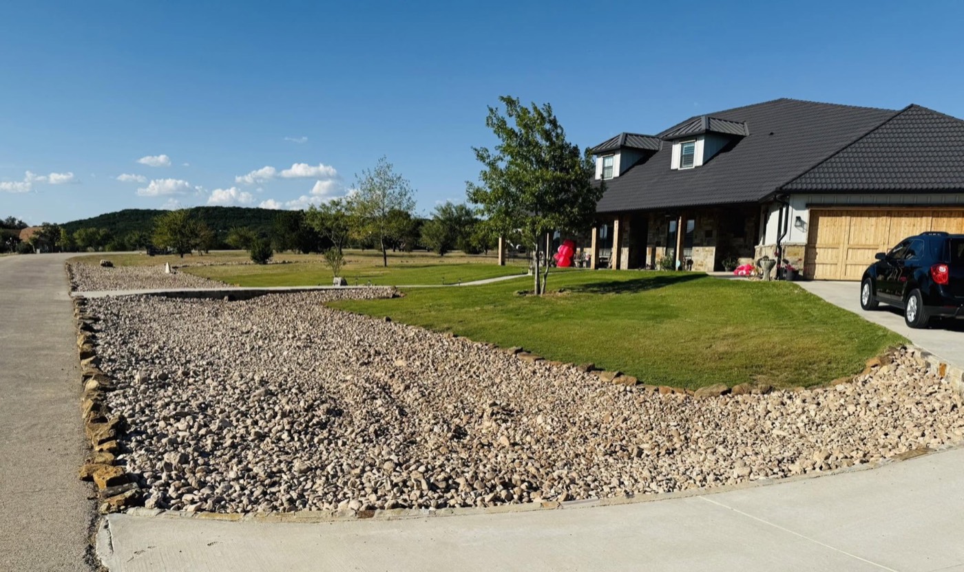 After: finished driveway and landscaped yard at a home