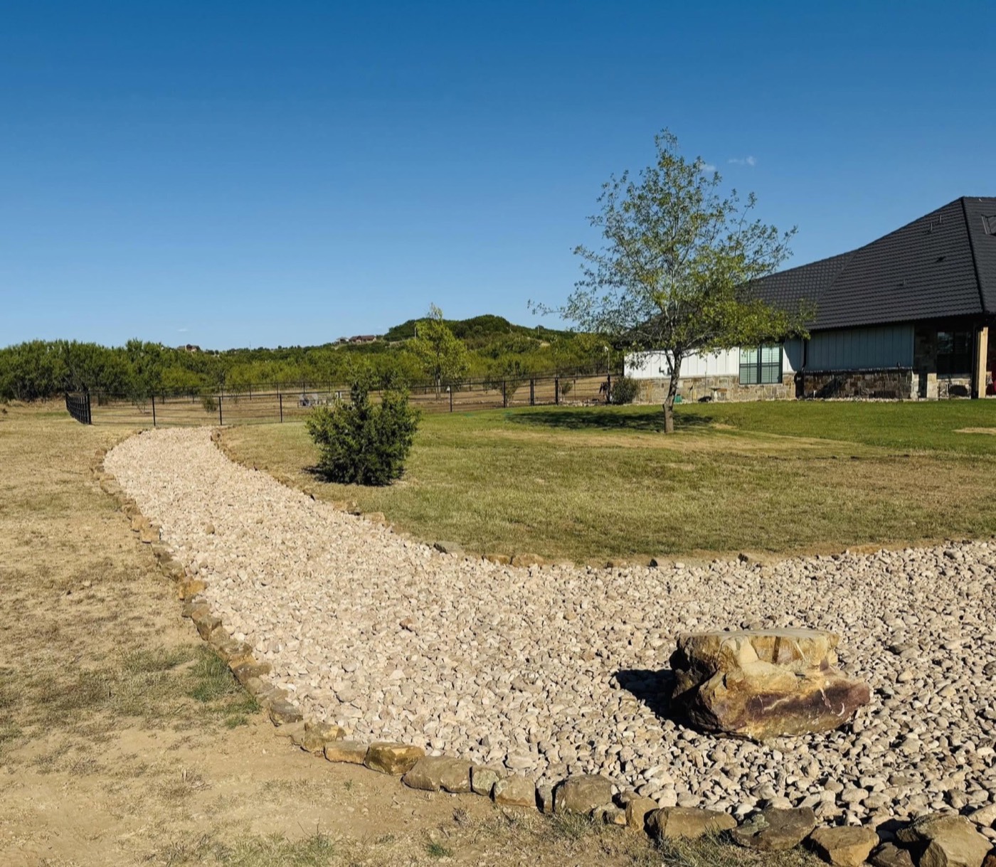 Decorative rock and landscape edging at the property